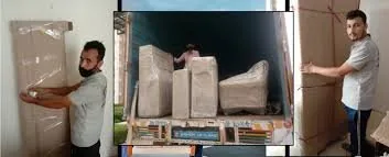 Crew stacking wrapped household goods inside the truck